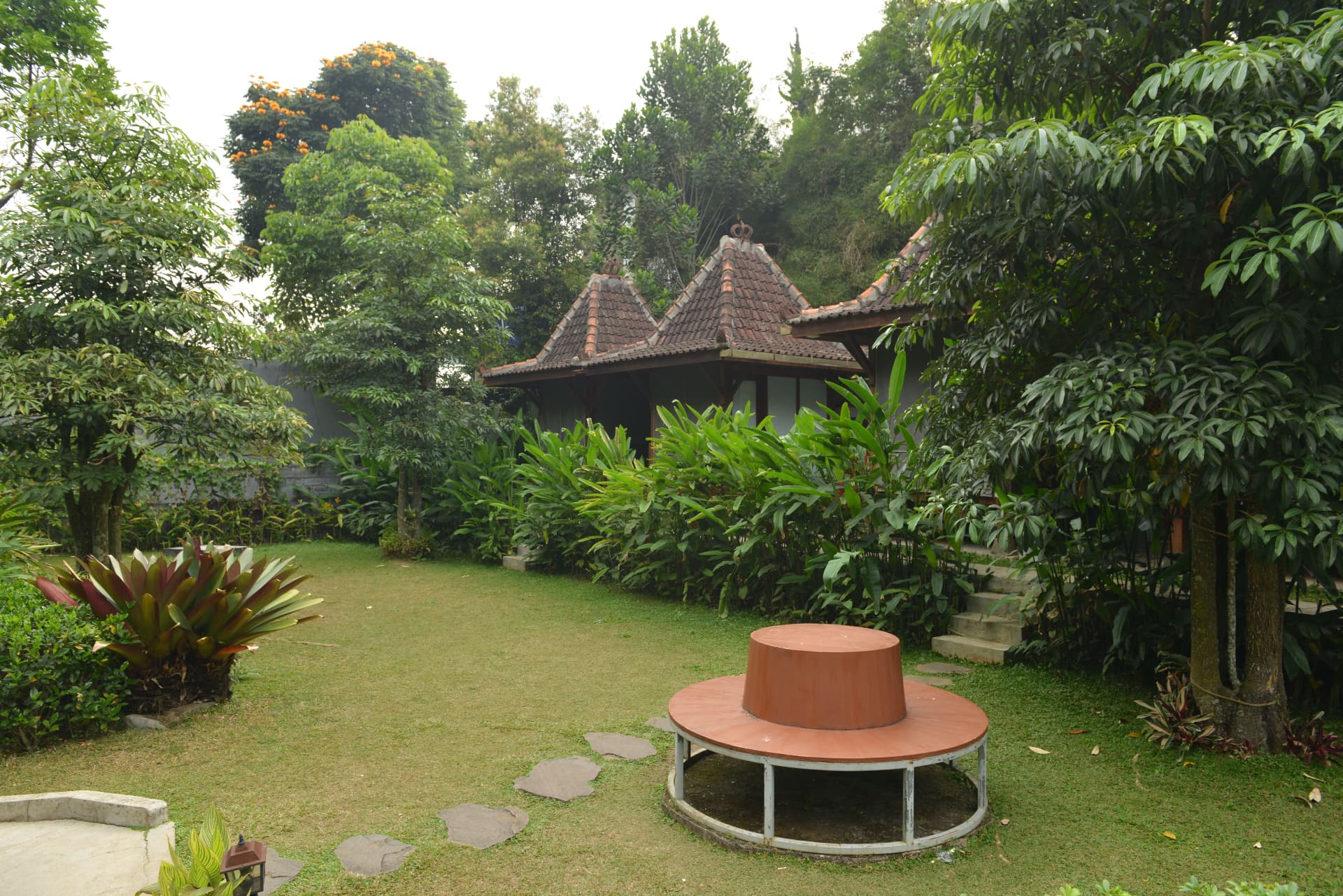 Garden lawn with Joglo pavilions in the background